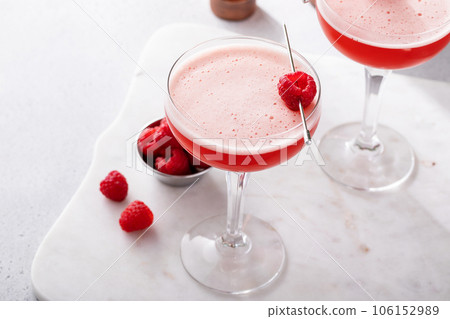 Raspberry martini cocktail with vodka, juice and raspberry liqueur Raspberry martini cocktail with vodka, juice and raspberry liqueur 106152989