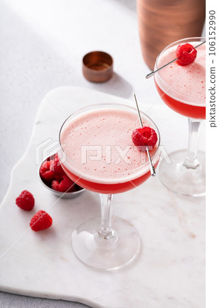 Raspberry martini cocktail with vodka, juice and raspberry liqueur 106152990