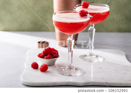 Raspberry martini cocktail with vodka, juice and raspberry liqueur 106152991