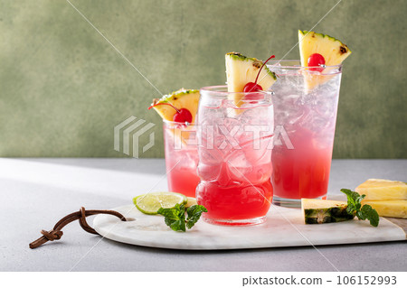 Singapore sling cocktail in variety of glasses 106152993