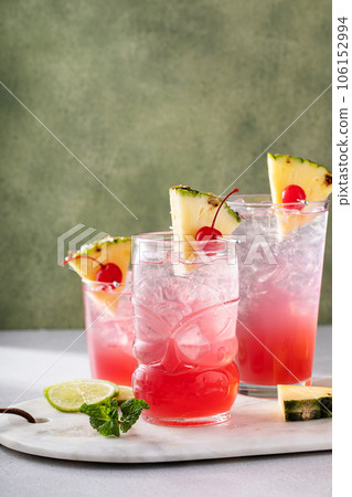 Singapore sling cocktail in variety of glasses 106152994