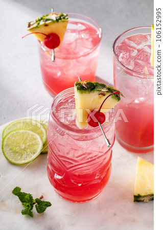 Singapore sling cocktail in variety of glasses 106152995