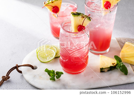 Singapore sling cocktail in variety of glasses 106152996