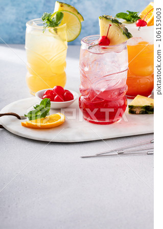 Zombie tropical cocktail with rum in tiki glasses 106153003
