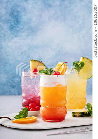 Zombie tropical cocktail with rum in tiki glasses 106153007