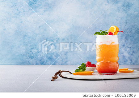 Zombie tropical cocktail with rum in tiki glasses 106153009