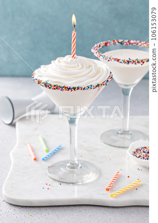 Birthday cake martini with sprinkles on rim 106153079