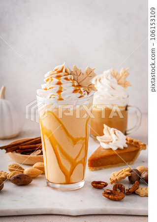 Pumpkin pie milkshake with caramel syrup and whipped cream 106153109