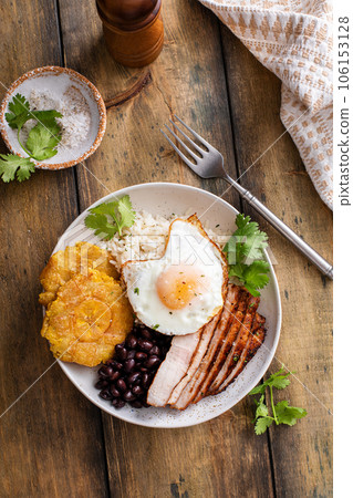 Caribbean or latin american breakfast with rice, beans and pork 106153128