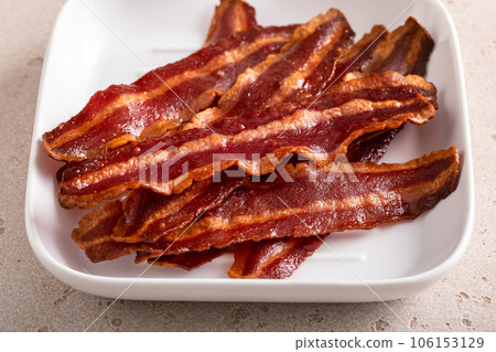 Turkey bacon cooked on a white plate iron pan Turkey bacon cooked on a white plate iron pan 106153129