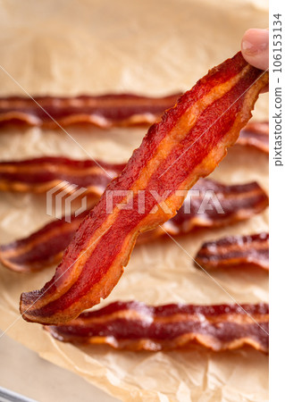 Turkey bacon crispy cooked on parchment paper Turkey bacon crispy cooked on parchment paper 106153134