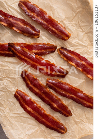 Turkey bacon crispy cooked on parchment paper Turkey bacon crispy cooked on parchment paper 106153137