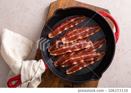 Turkey bacon cooked on a cast iron pan Turkey bacon cooked on a cast iron pan 106153138