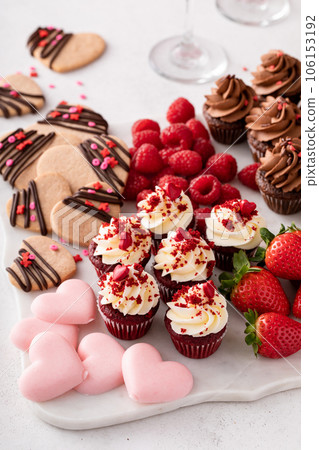 Valentines day charcuterie board with cupcakes and strawberries 106153192
