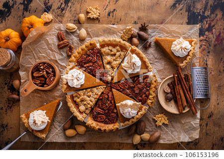 Traditional fall Thanksgiving pie slices, pumpkin and pecan pie 106153196