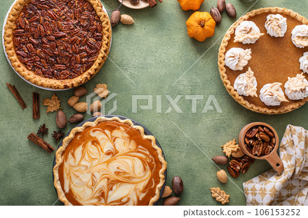 Traditional fall Thanksgiving pies, pumpkin and pecan pie 106153252