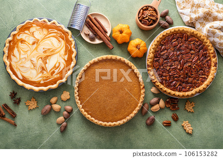 Traditional fall Thanksgiving pies, pumpkin and pecan pie 106153282