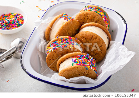 Ice cream and cookies sandwiches stacked on the table 106153347