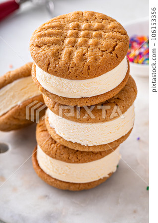 Ice cream and cookies sandwiches stacked on the table 106153356