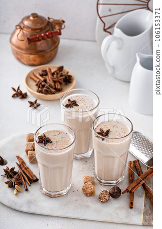 Chai in tall glasses with whole spices 106153371