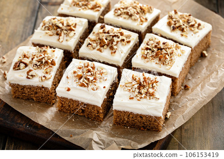 Carrot or pumpkin spiced cake with cream cheese frosting and pecan Carrot or pumpkin spiced cake with cream cheese frosting and pecan 106153419
