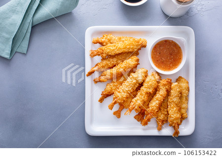 Tempura shrimp on a plate served with sweet and sour sauce 106153422