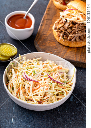 Traditional cole slaw salad, side dish for pulled pork sandwich Traditional cole slaw salad, side dish for pulled pork sandwich 106153434