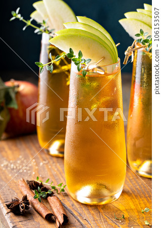 Apple cider mimosa for fall brunch, autumn cocktail idea Apple cider mimosa for fall brunch, autumn cocktail idea 106153507