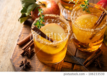 Apple cider margarita with brown sugar rim and cinnamon stick Apple cider margarita with brown sugar rim and cinnamon stick 106153530
