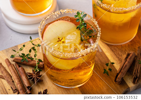 Hard apple cider cocktail with cinnamon and thyme, fall drink 106153532
