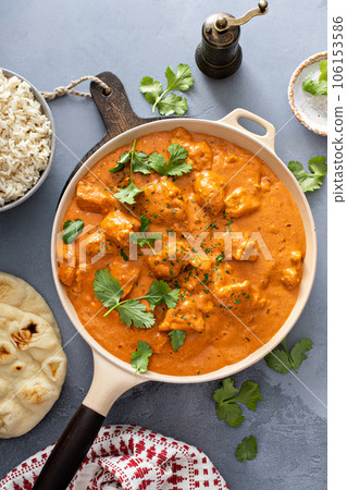 Chicken tikka masala, cooked marinated chicken in spiced curry sauce Chicken tikka masala, cooked marinated chicken in spiced curry sauce 106153586