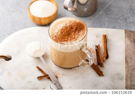 Coffee with collagen powder added topped with cinnamon 106153639