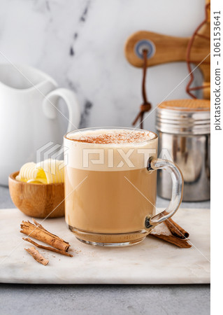 Bulletproof coffee in a glass mug with cinnamon 106153641