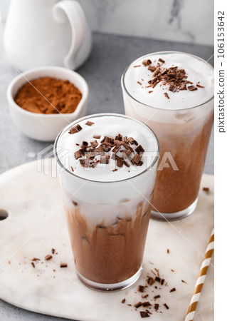 Cold hot chocolate in tall glasses with milk foam Cold hot chocolate in tall glasses with milk foam 106153642
