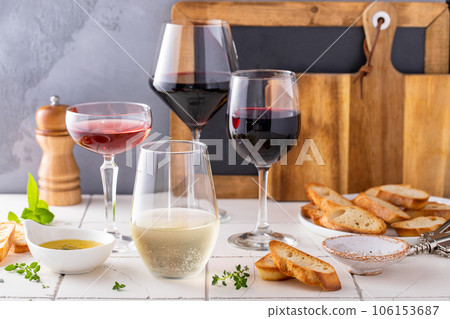 Variety of wine glasses with red, white and rose wine Variety of wine glasses with red, white and rose wine 106153687