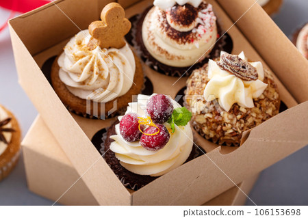 Variety of festive Christmas cupcakes on the table 106153698