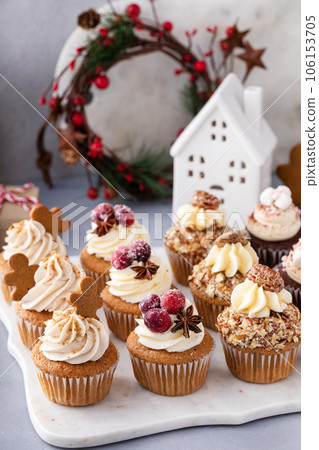 Variety of festive Christmas cupcakes on the table 106153705
