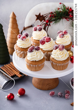 Sugared cranberry spiced cupcakes with cream cheese frosting 106153744