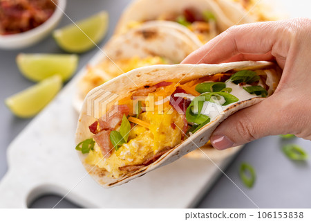 Breakfast tacos with hashbrowns, eggs and bacon 106153838