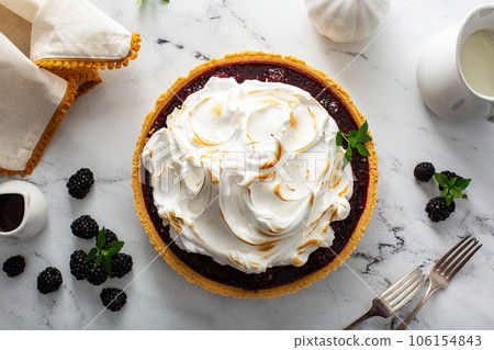 Blackberry pie topped with toasted meringue, dessert idea Blackberry pie topped with toasted meringue, dessert idea 106154843