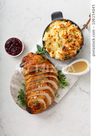 Roasted turkey breast sliced on a plate for holidays 106154845