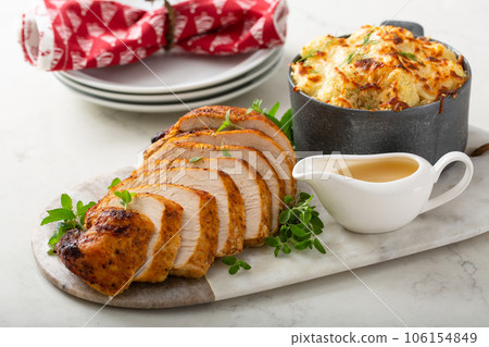 Roasted turkey breast sliced on a plate for holidays 106154849