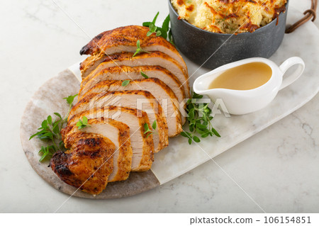 Roasted turkey breast sliced on a plate for holidays Roasted turkey breast sliced on a plate for holidays 106154851