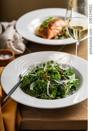 Fall kale salad with fennel and pumpkin seeds 106154881
