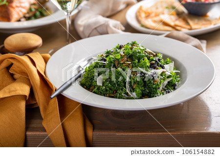 Fall kale salad with fennel, pumpkin seeds and cherry Fall kale salad with fennel, pumpkin seeds and cherry 106154882