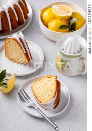 Lemon bundt cake drizzled with powdered sugar glaze 106154980