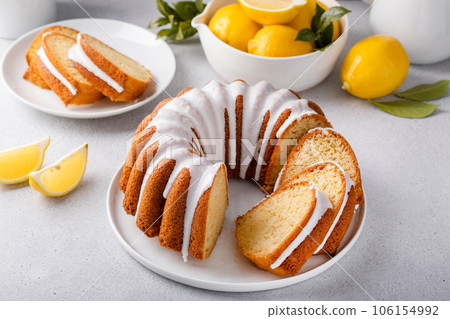 Lemon bundt cake drizzled with powdered sugar glaze 106154992