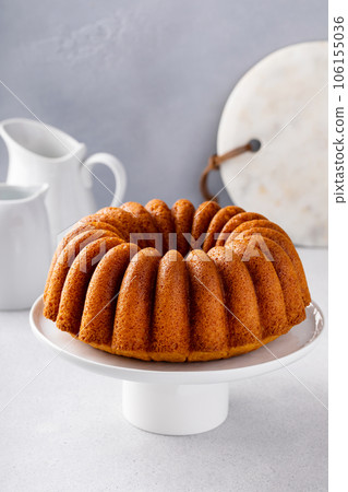 Vanilla bundt cake golden freshly baked ready to eat Vanilla bundt cake golden freshly baked ready to eat 106155036