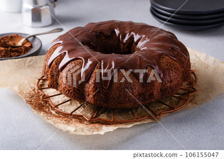 Chocolate bundt cake with chocolate ganache glaze 106155047