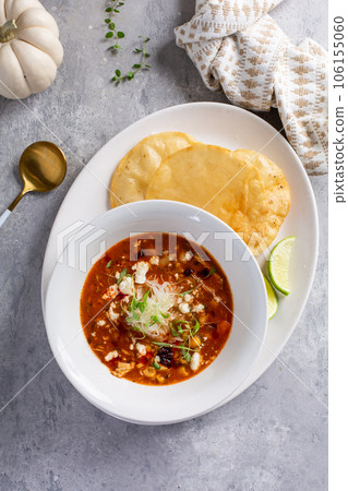 Mexican chicken soup topped with cotija cheese Mexican chicken soup topped with cotija cheese 106155060